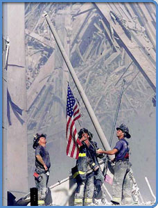 Photo of three firemen raising the U.S. Flag after the disaster at the World Trade Center on September 11, 2001.
