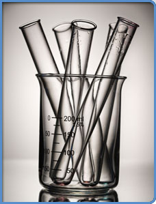 A glass full of vials.